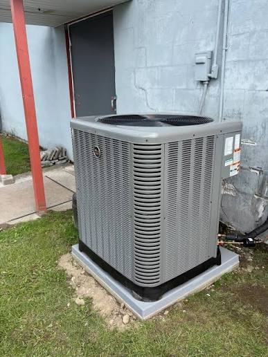 Outdoor air conditioner on a level pad