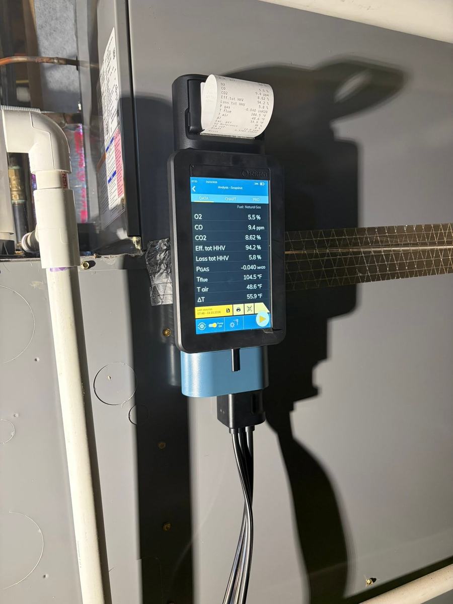 Combustion analyzer showing carbon monoxide, oxygen and efficiency readings