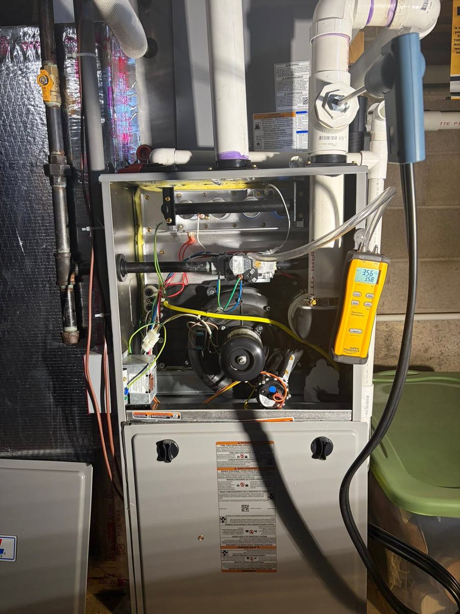 Digital manometer connected to a gas furnace